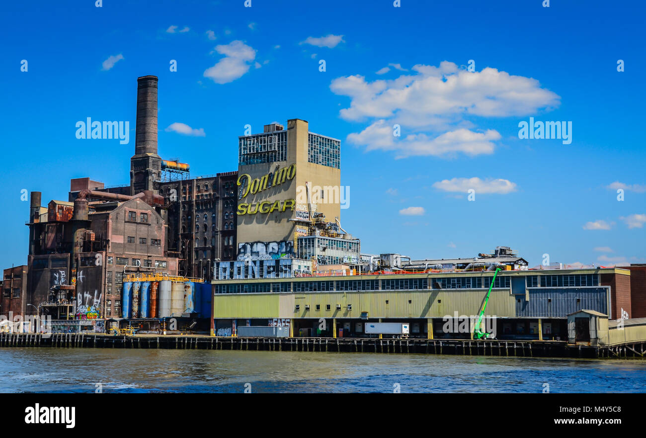 The Domino Sugar Refinery is a former refinery in the neighborhood of Williamsburg in Brooklyn, New York City. Stock Photo