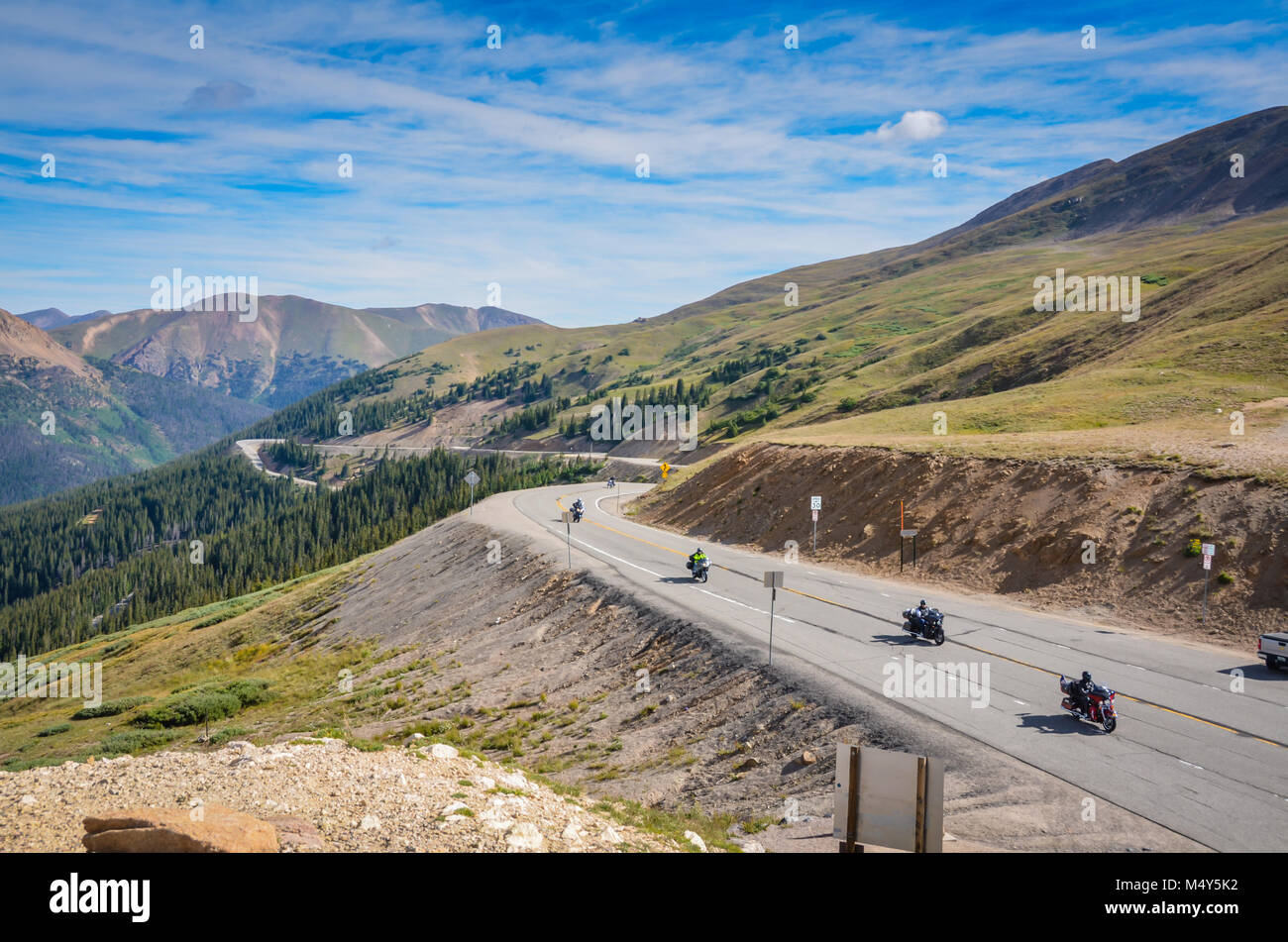 Motorcycles touring on road at Loveland Pass amidst Rocky Mountains in Colorado, USA. Stock Photo