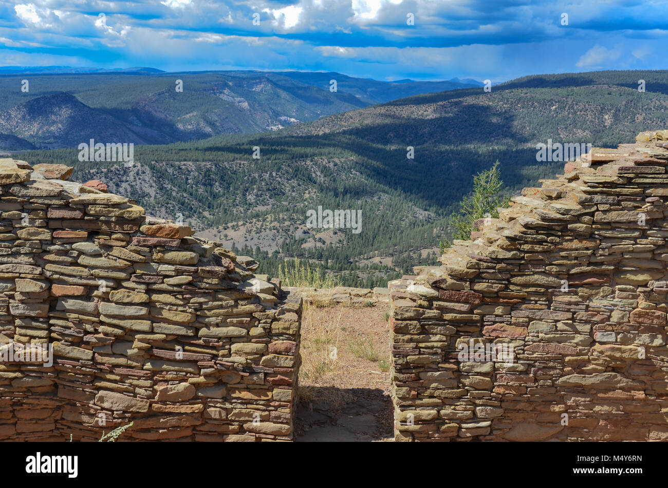 View of Chaco Canyon through kiva doorway at Chimney Rock National Monument. Stock Photo