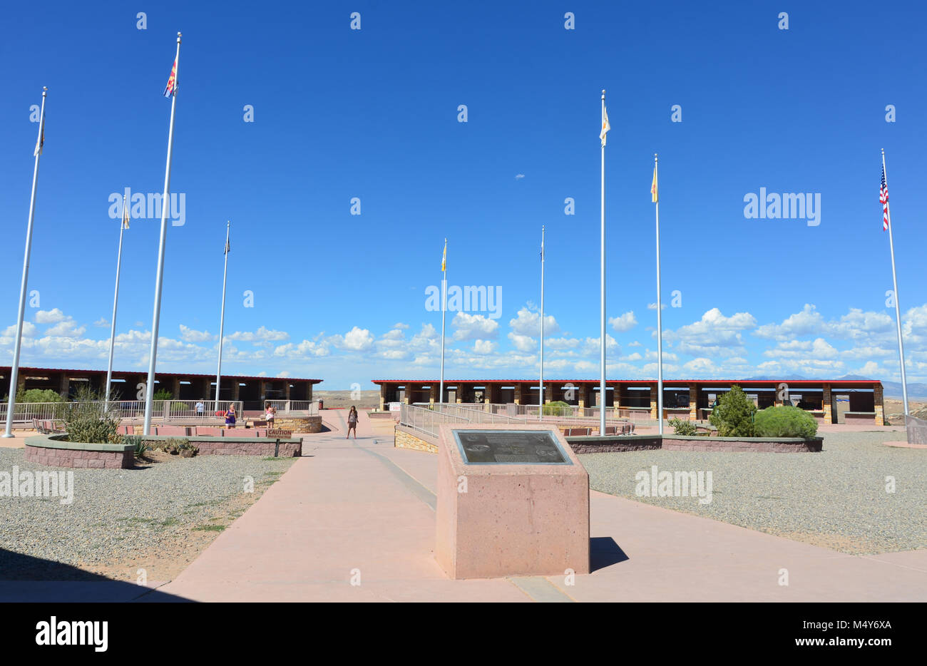 Visitor standing on Four Corners, a region of the United States consisting of corners of Colorado, Utah, Arizona, and New Mexico. Stock Photo