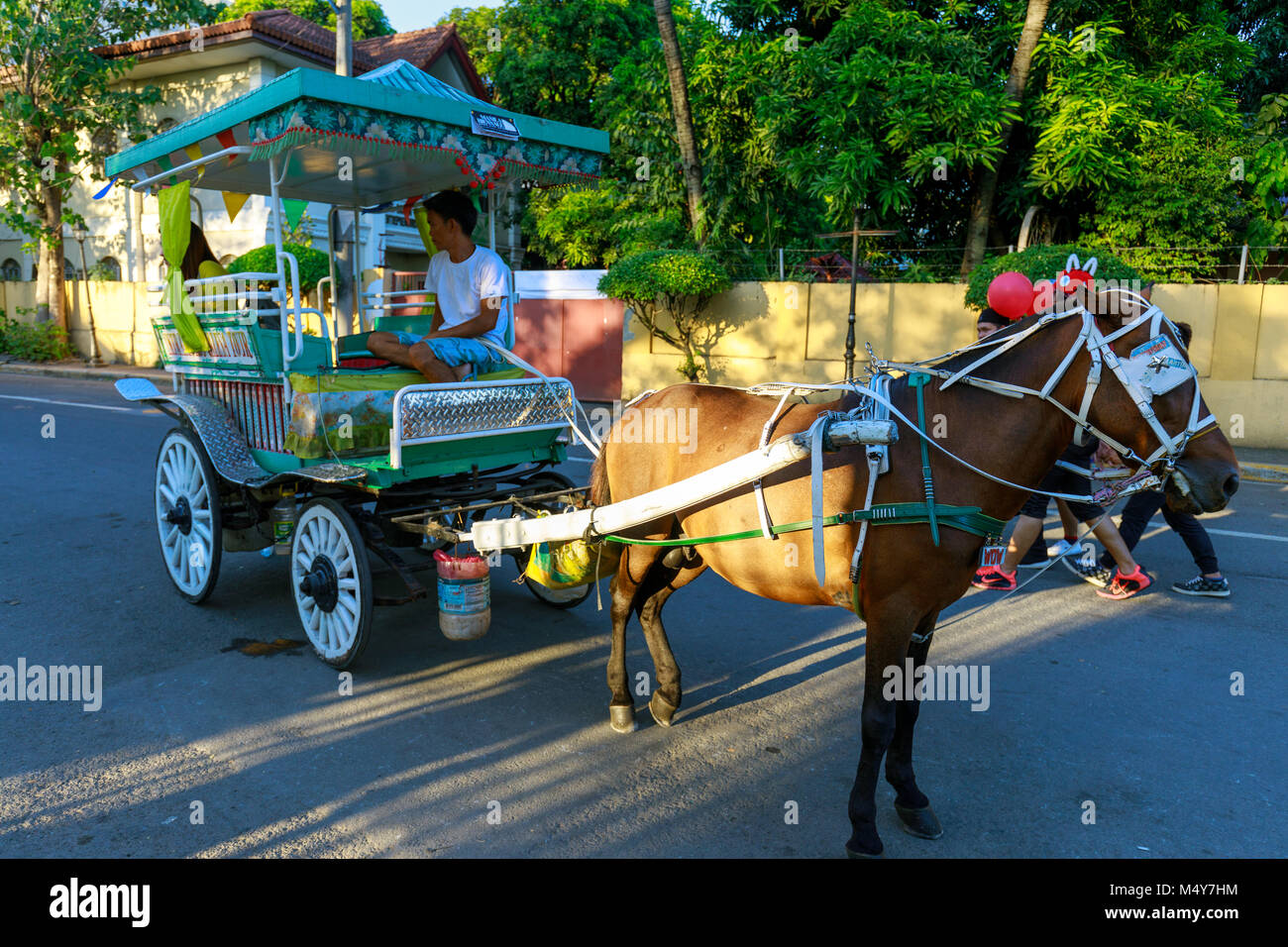 Manila, Philippines - Feb 17, 2018 : Horse with carriage waiting for tourists in Intramuros district Stock Photo