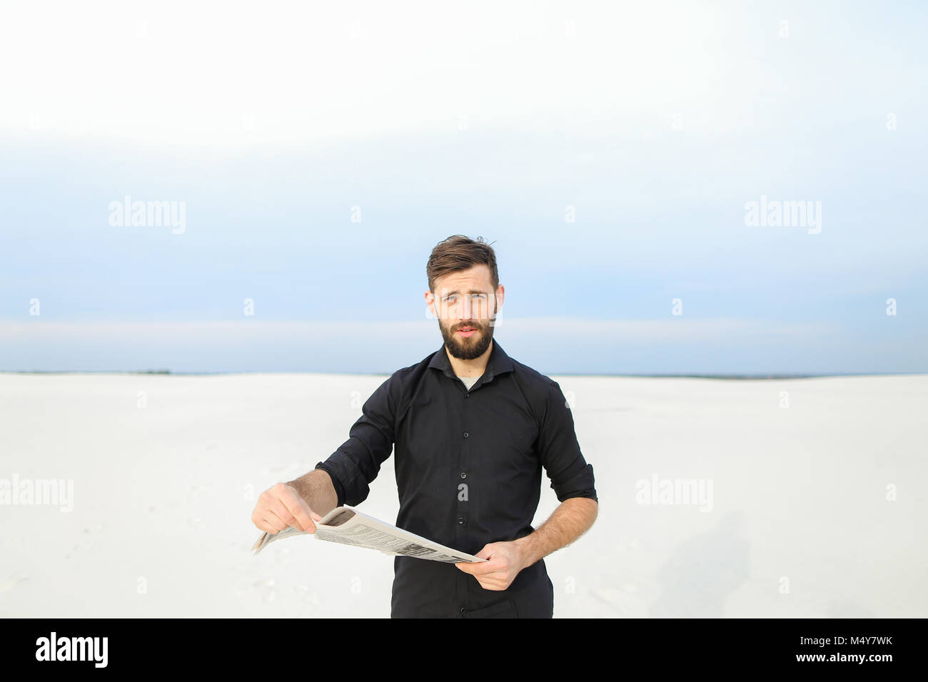 Bearded man reading newspaper on hi-res stock photography and images ...