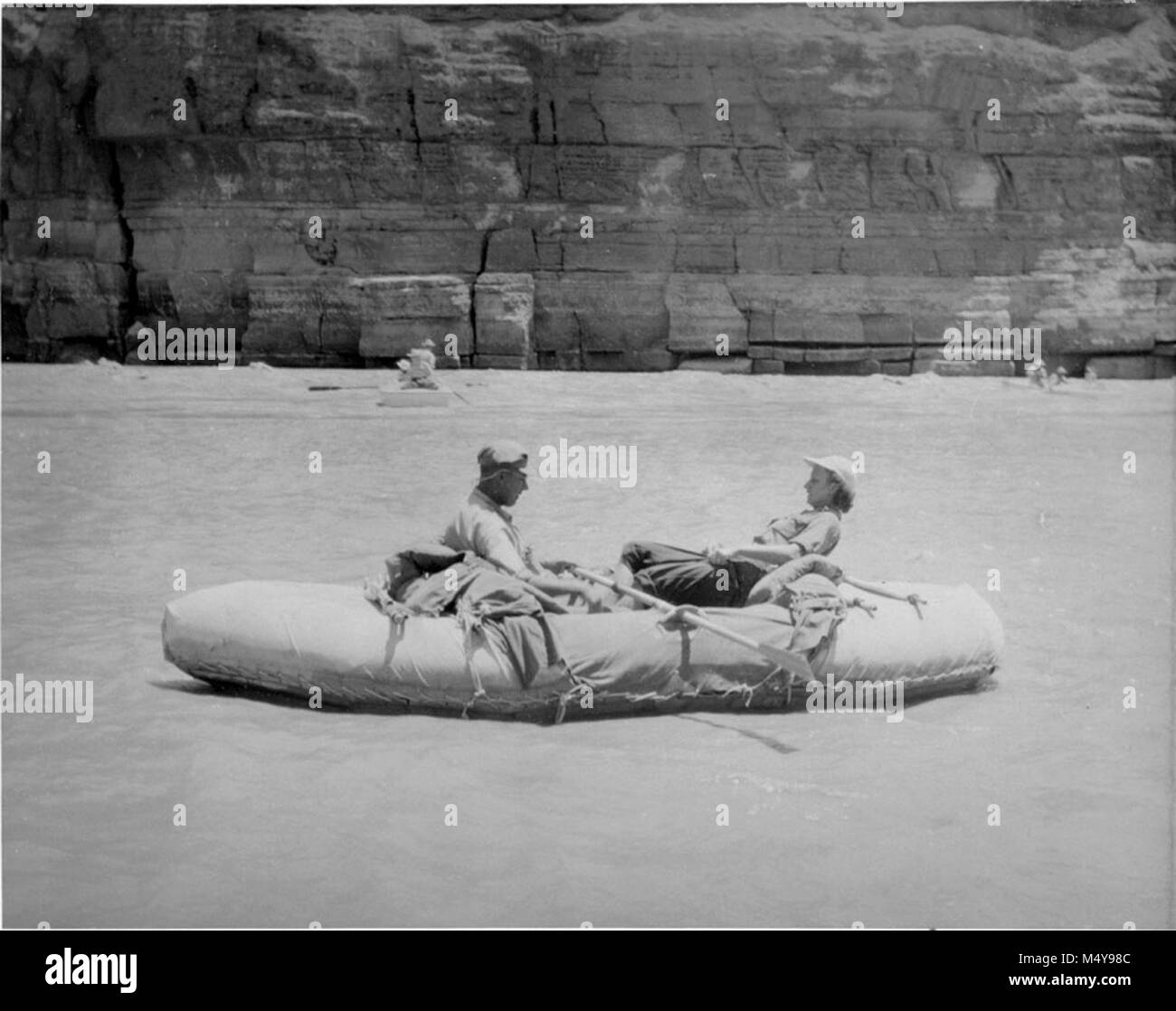 BILL DAVIS AND HIS WIFE IN RUBBER RAFT AT LEES FERRY, JULY 1952. THE ...