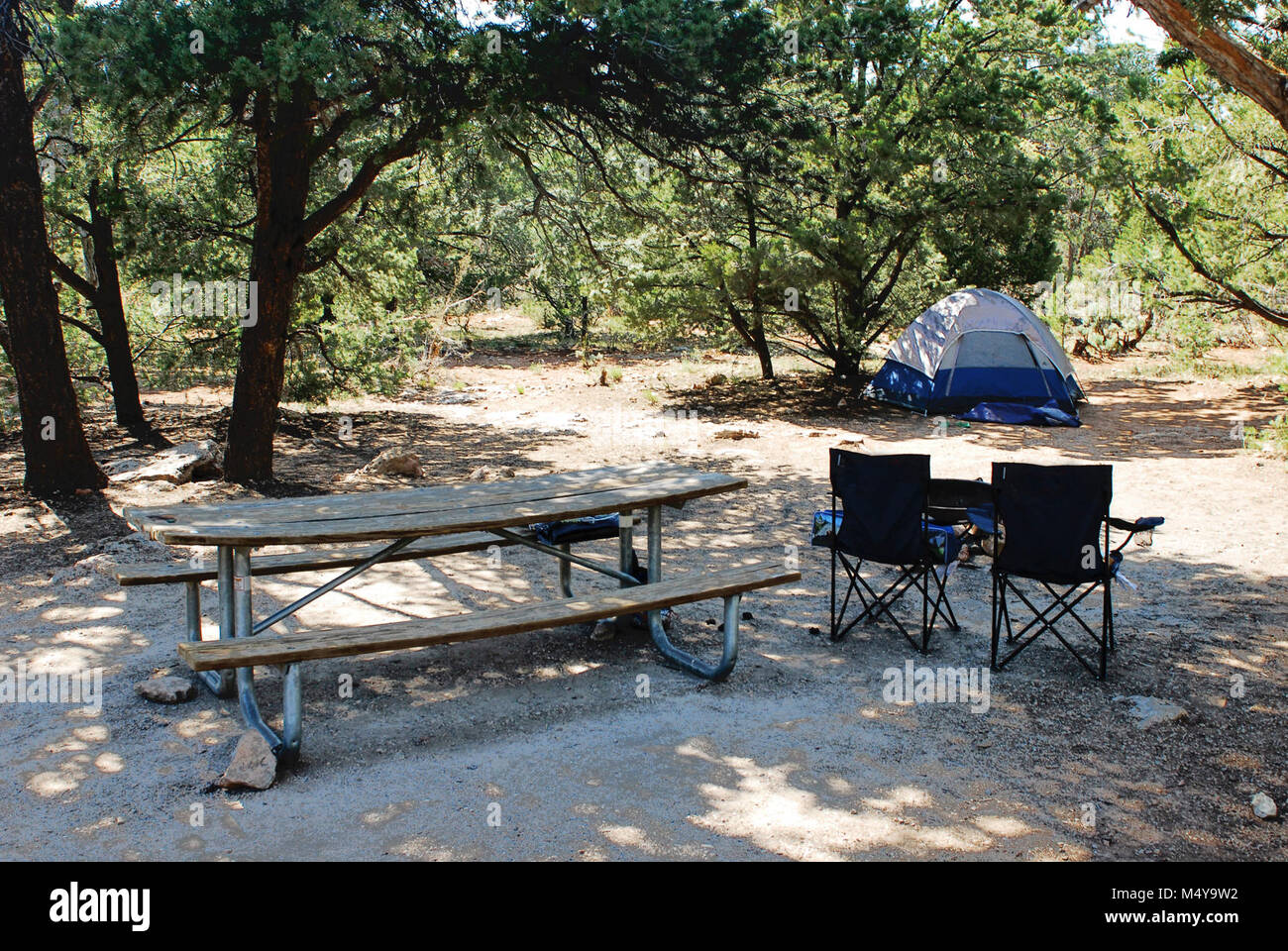 Mather Campground Drive-through Site.  - No hook-ups. - 30-foot trailer or RV maximum.  Open year-round. Operated by the National Park Service and located in Grand Canyon Village, this campground offers tent and RV camping. Accessible campsites and restrooms are available. Pets are allowed, but must be leashed at all times, and may not be left unattended. Wood and charcoal fires permitted in provided campsite grills only. No gathering of down wood, wood may be purchased at the general store. Laundry and showers located near the campground for a fee.. .  Grand Canyon National Park Mather Campgr Stock Photo