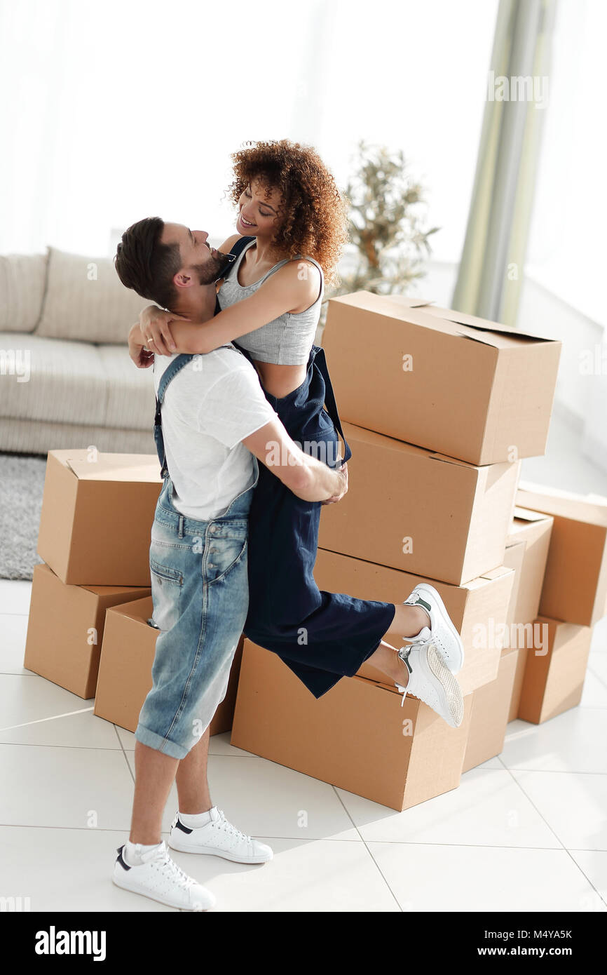 Portrait of a young couple moving into a new home Stock Photo - Alamy