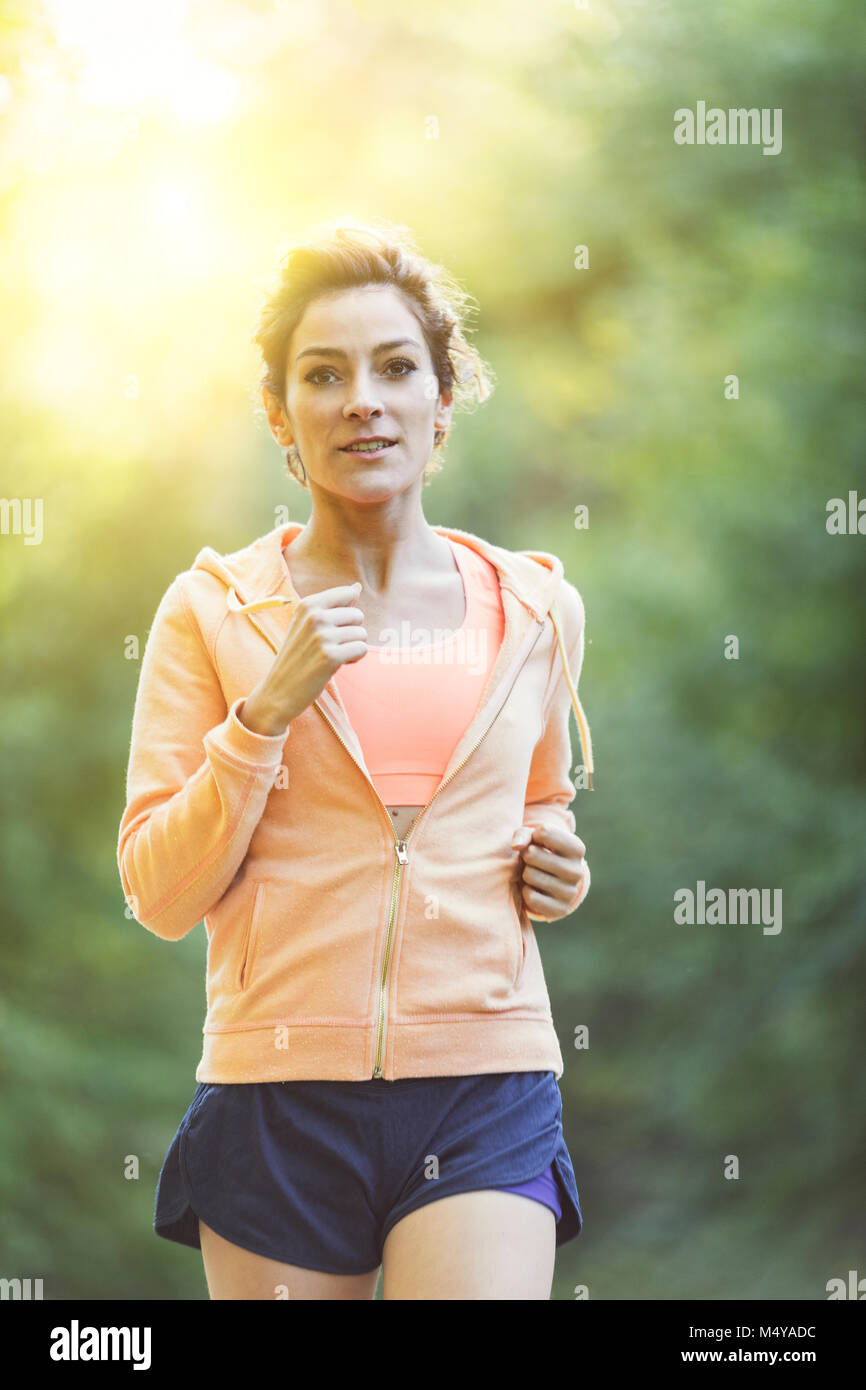 Young woman running in the nature Stock Photo