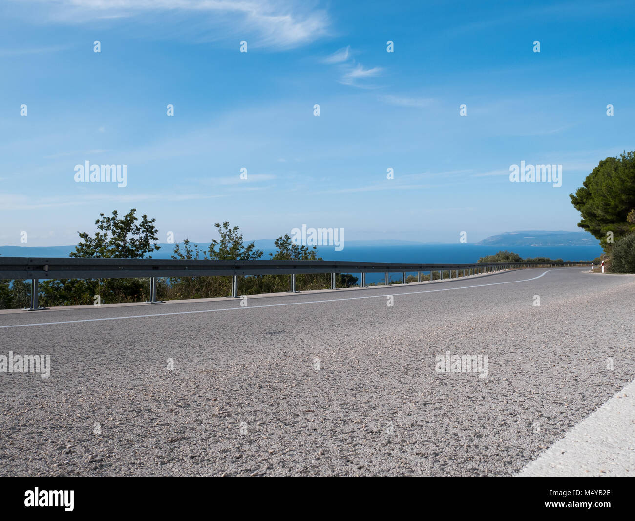 Road on Adriatic sea coast on sunny day Stock Photo