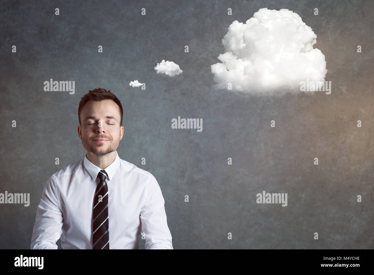 Relaxed and balanced man with a thought bubble Stock Photo