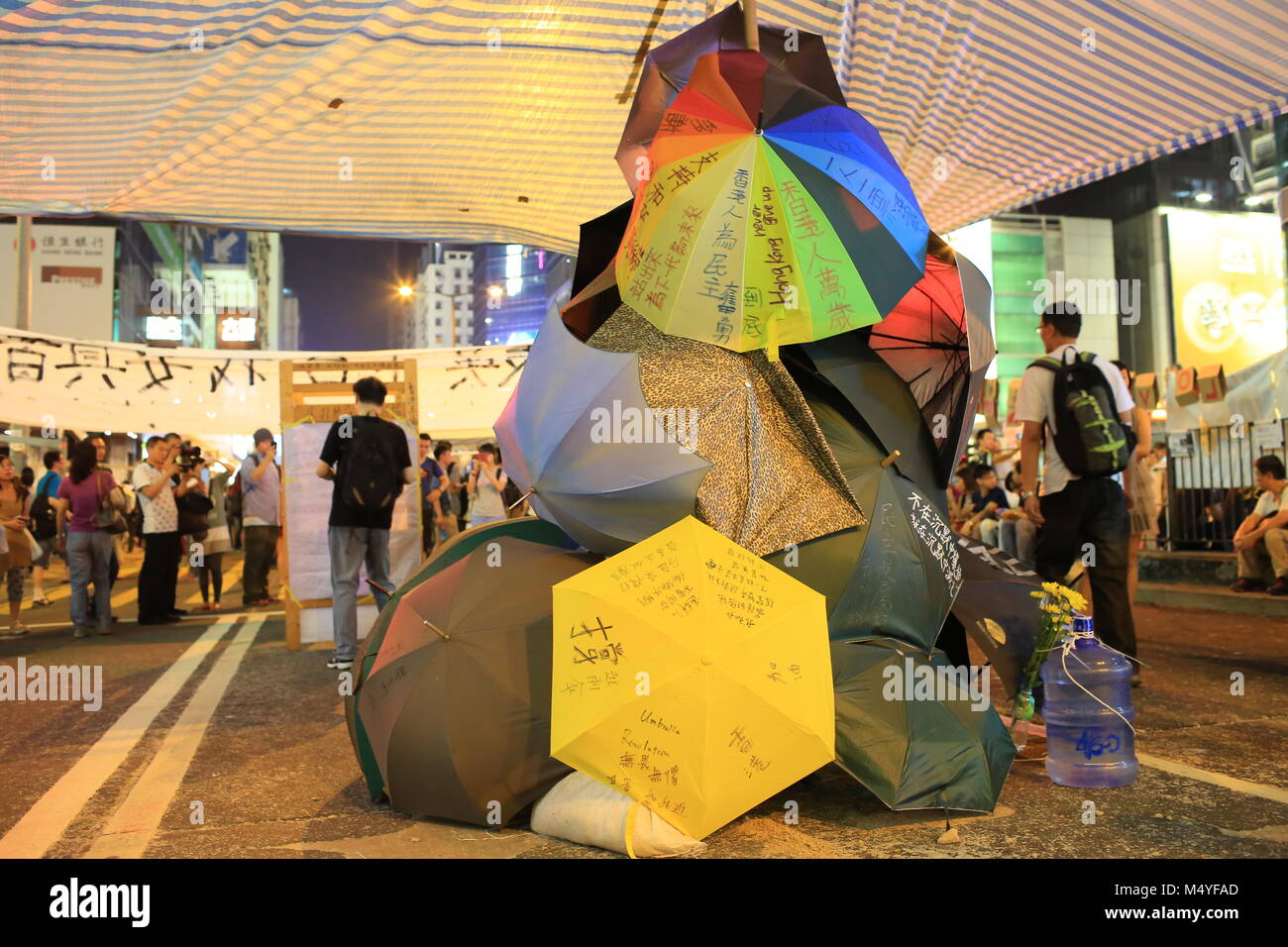 HONG KONG,OCT. 12:people hang the yellow umbrella, symbol of revolution in ocuppy protest  in Mong Kok on 12 october 2014.  Umbrella revolution two week ago, people is still insist on it Stock Photo