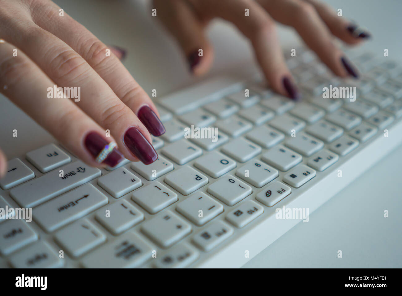 Business woman is typing text on a computer keyboard. Stock Photo