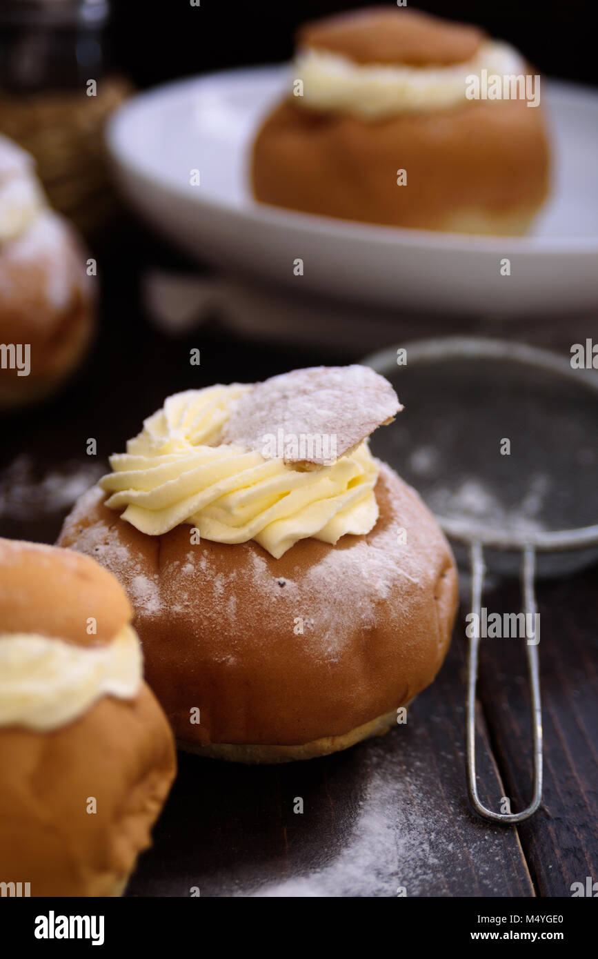 Semla swedish cream bun on dark wooden  background Stock Photo