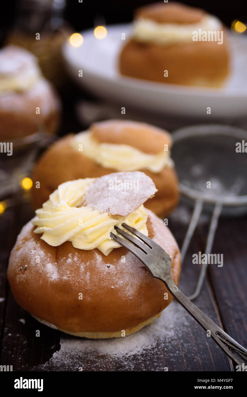 Semla swedish cream bun on dark wooden  background Stock Photo