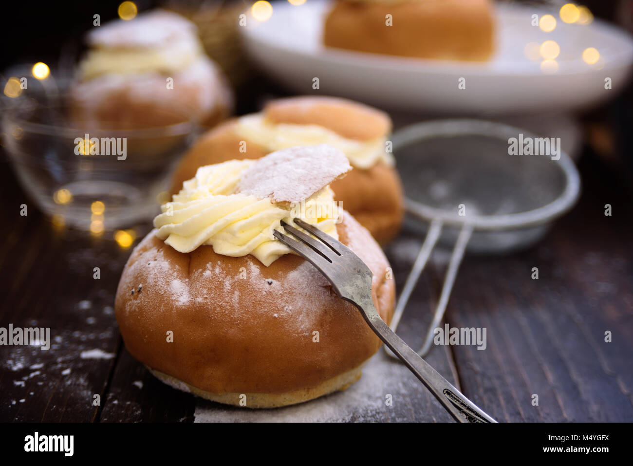 Semla swedish cream bun on dark wooden  background Stock Photo