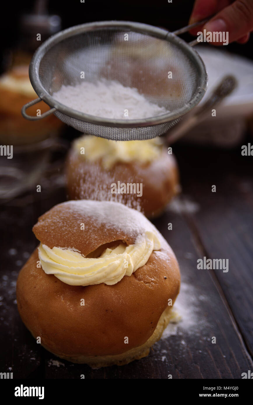 Semla swedish cream bun on dark wooden  background Stock Photo