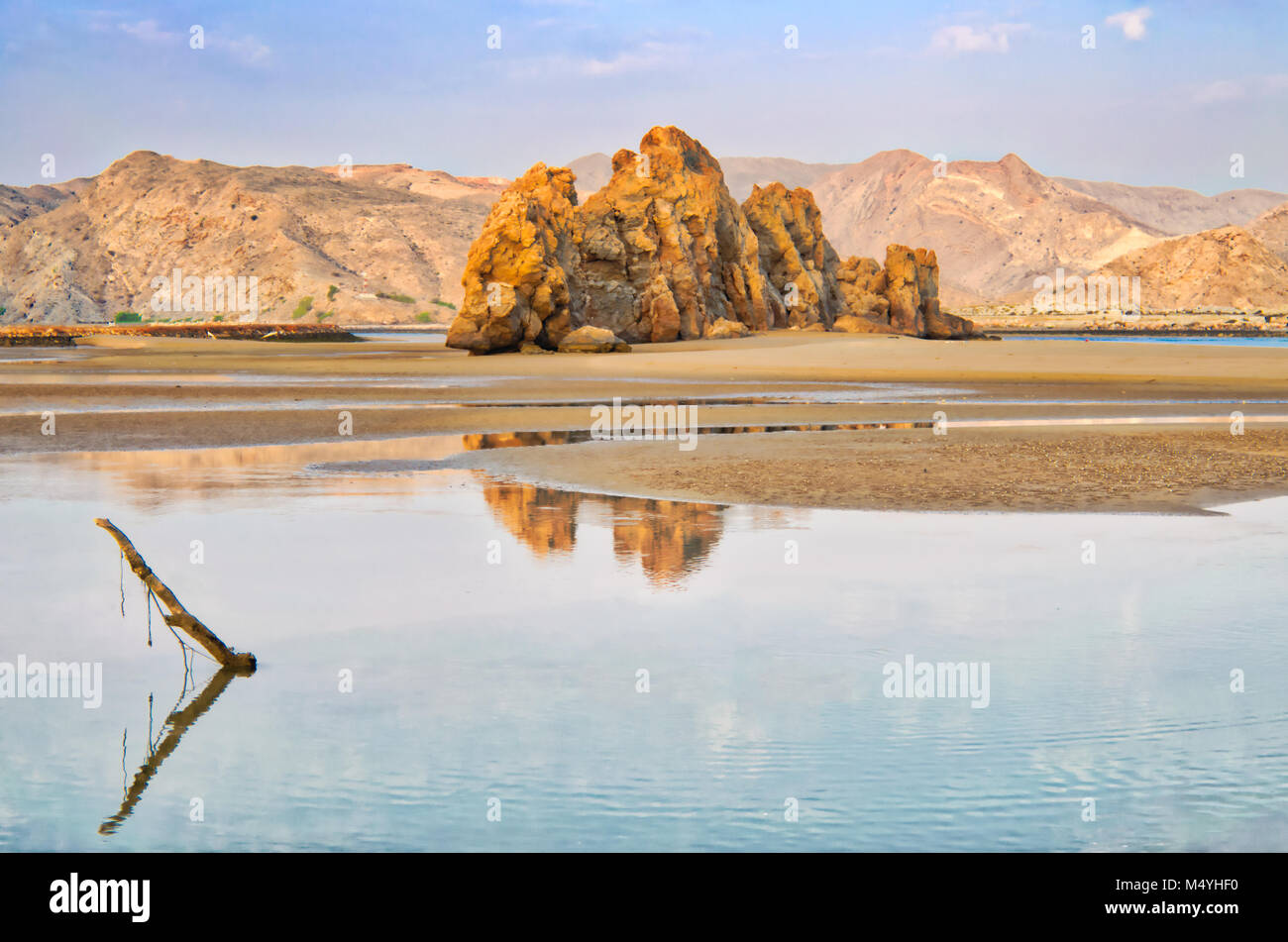 Omani landscape and blue sky reflected on the water. Stock Photo
