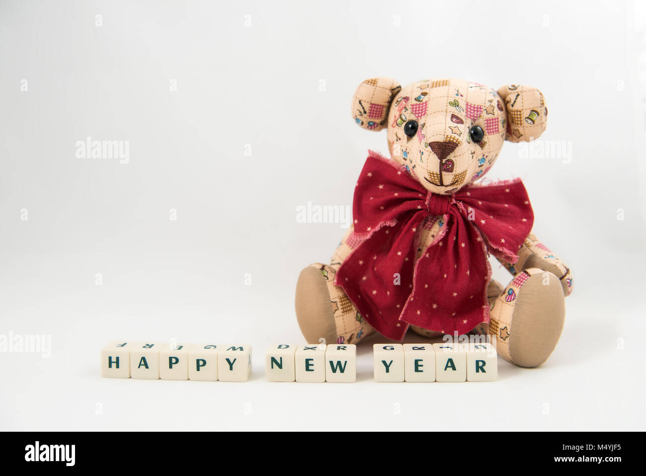 Happy NEW Year white cube text and Teddy bear Stock Photo