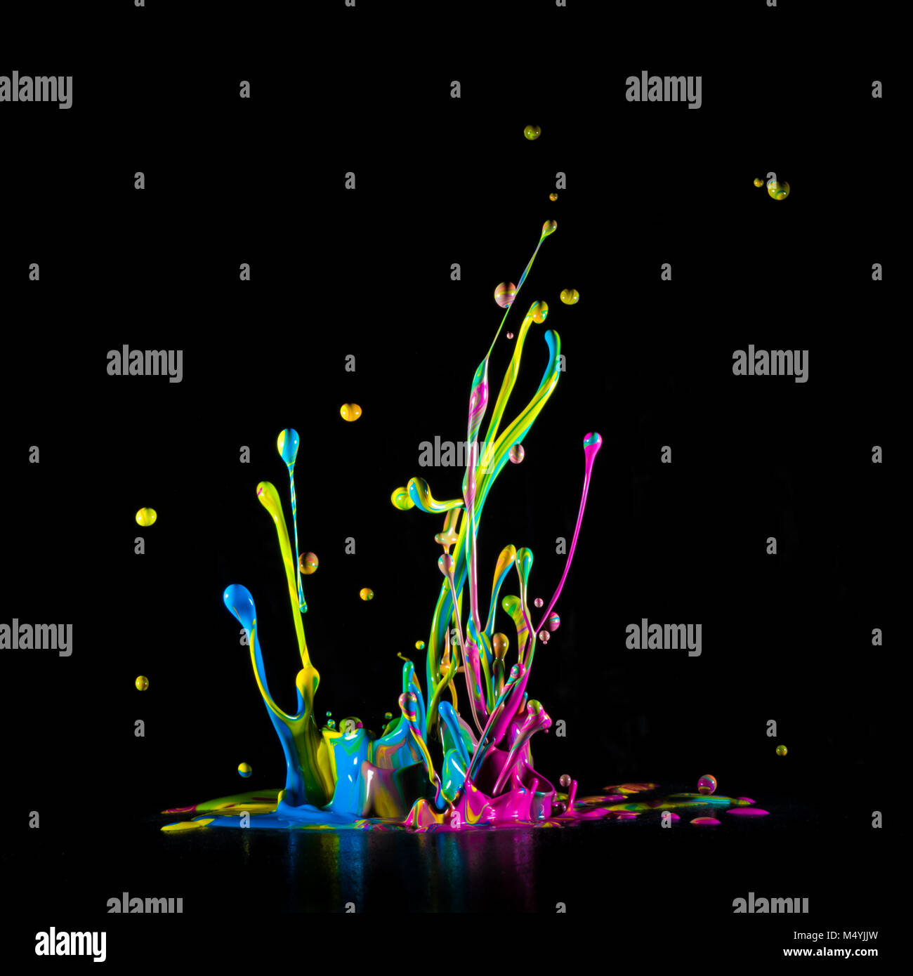 Colour paint splashes isolated on black background Stock Photo