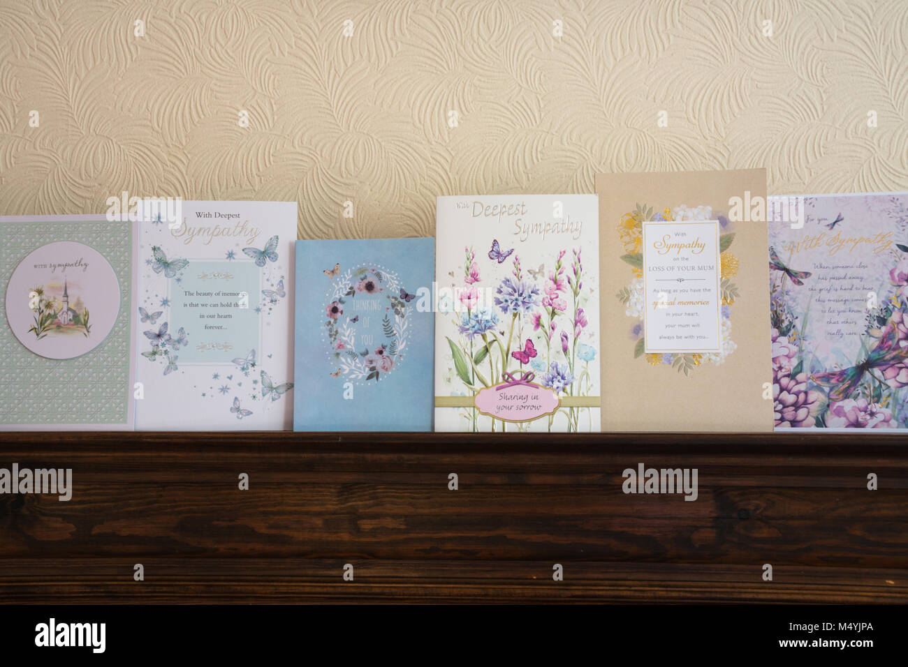 Row of sympathy cards on a mantelpiece Stock Photo