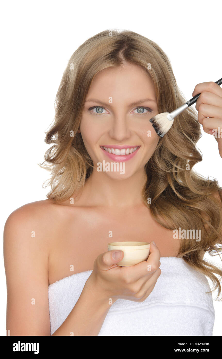 European woman moisturizing her skin with oil Stock Photo