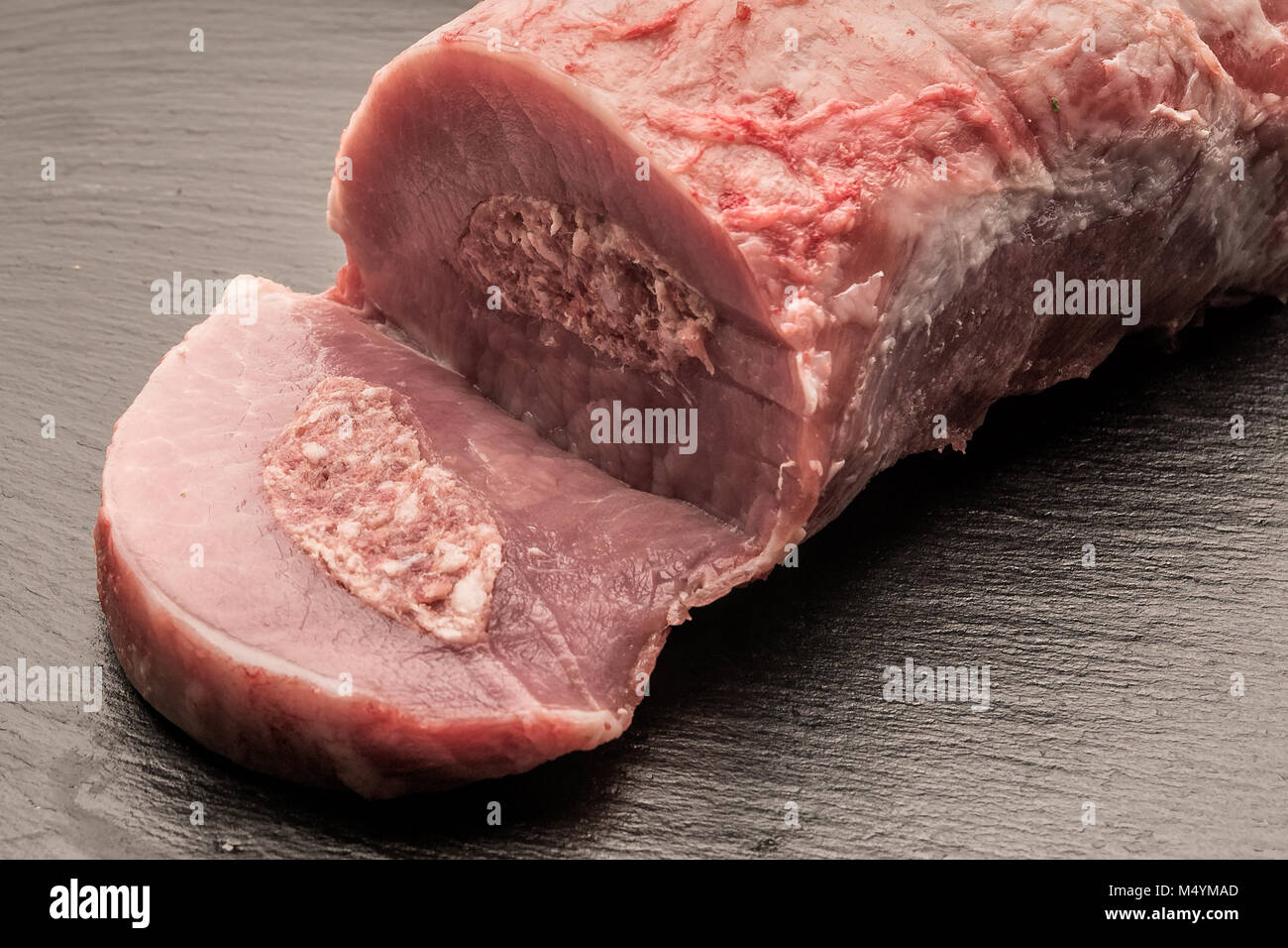 Product photos, Slaughter, Food, Germany, Rhineland-Palatinate, February 17. Freshly slaughtered pork. A meat filled with Mett lies on a plate. Stock Photo