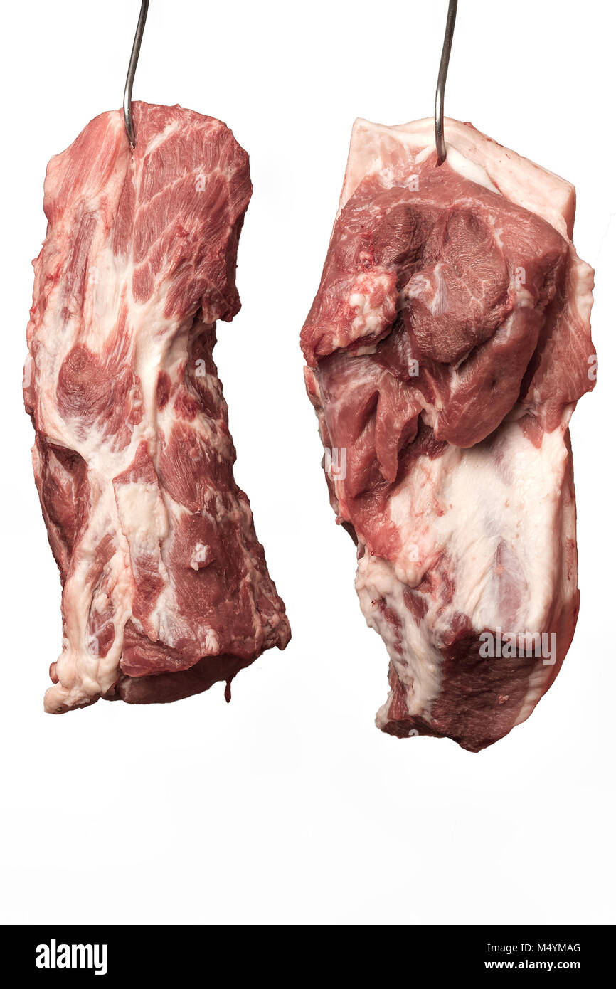Product photos, Slaughter, Food, Germany, Rhineland-Palatinate, February 17. Freshly slaughtered pork. Two flesh hang on butcher's hook. Stock Photo