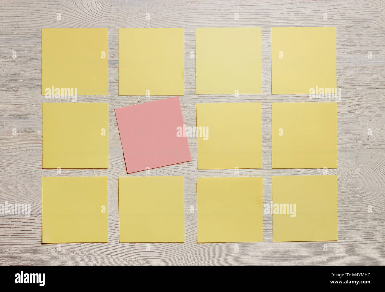 Stationary, Blank Colored Sticker Notes on White Wooden Board. Top View. Flat Lay. Time-management, Planning. Stock Photo