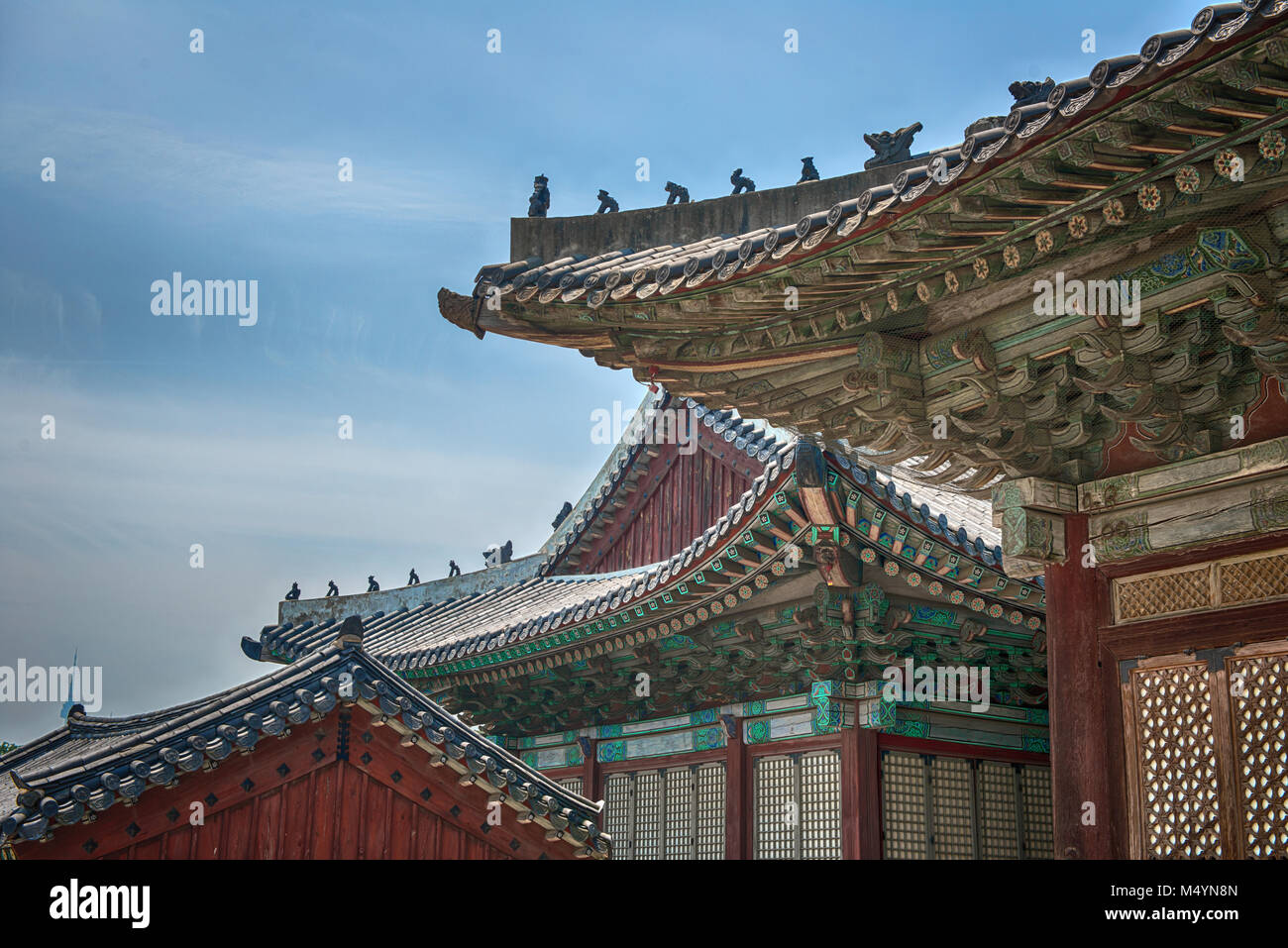 Traditional korea roof decoration. blue sky and Colorful structures Stock Photo