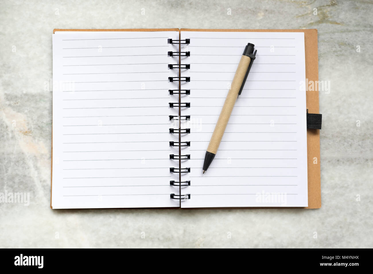 Notebook lie on a marble background, from above Stock Photo - Alamy