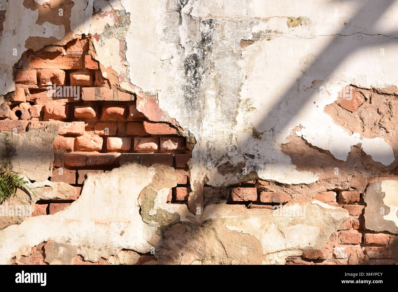 Deteriorating brick wall Stock Photo