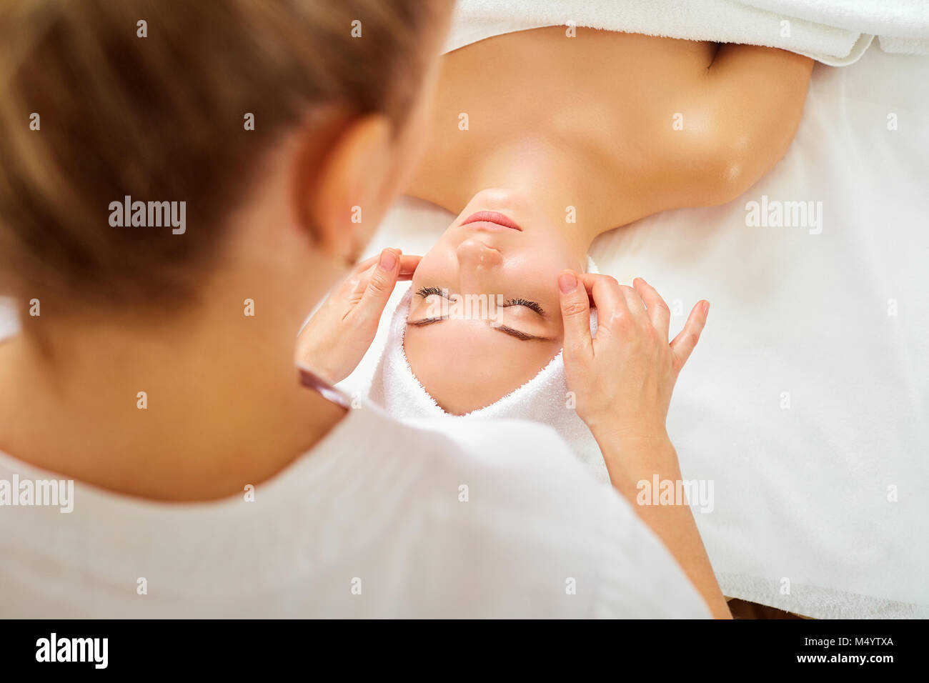 Beautiful woman at a facial massage at a spa salon Stock Photo