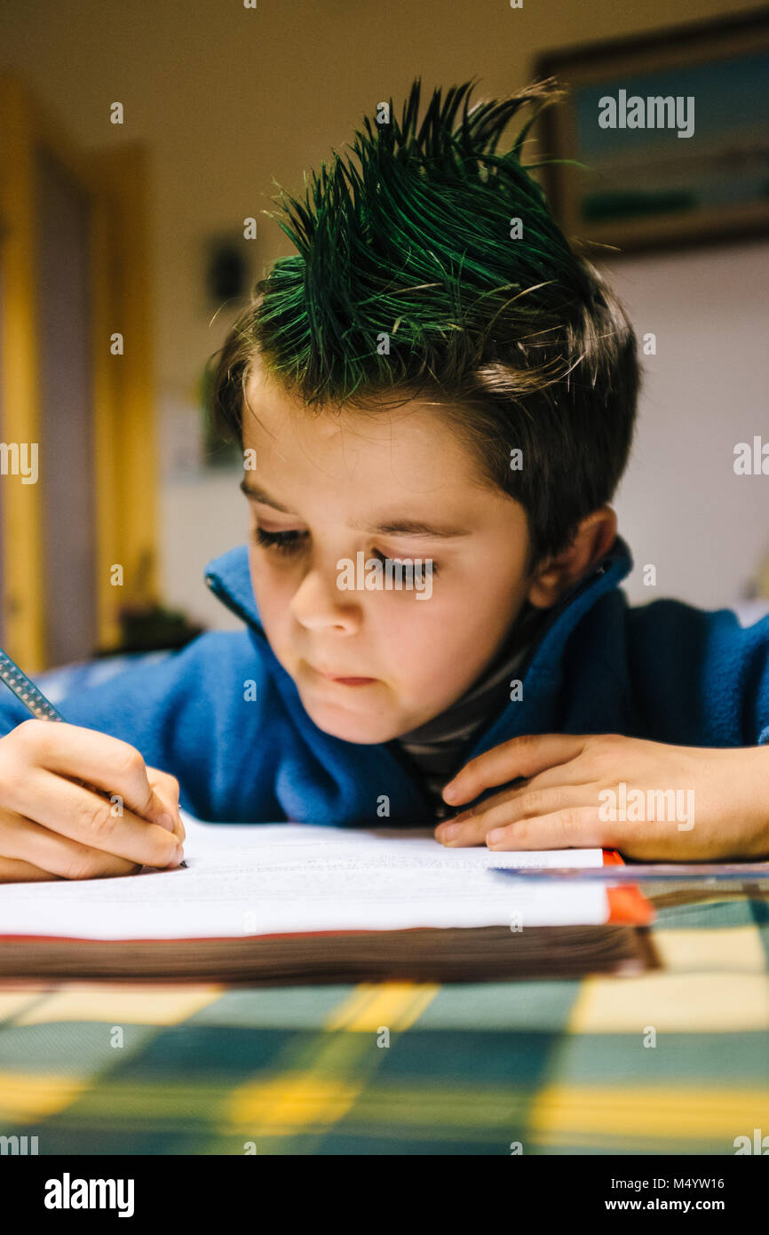Portrait Of 9 Year Old Boy At Home With Green Colored Hair Crest