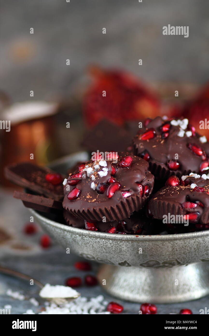 Homemade chocolate muffins with pomegranate fruits and sea salt Stock Photo