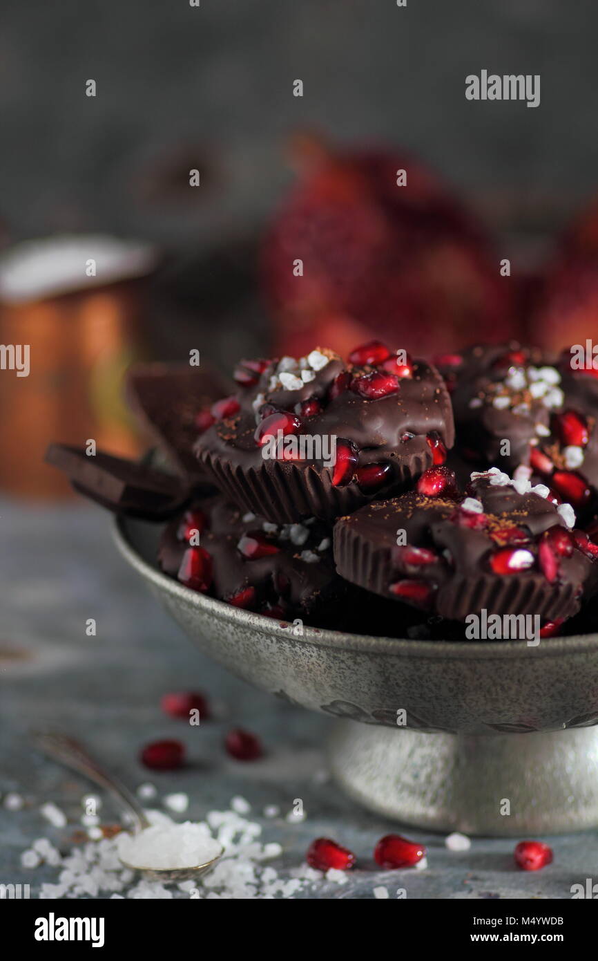 Chocolate muffins with pomegranate fruits and sea salt Stock Photo