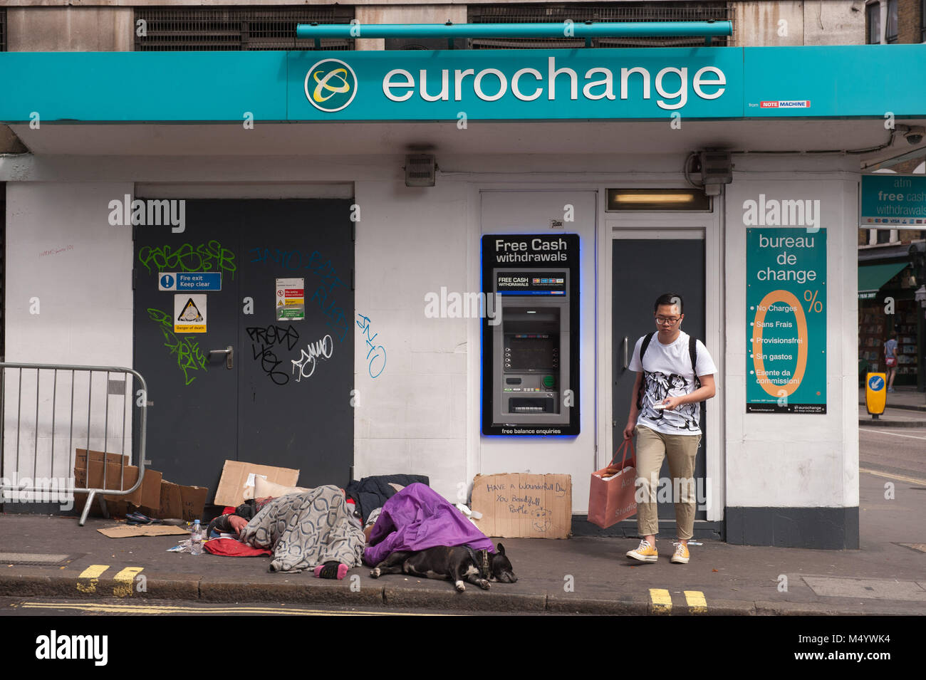 London, United Kingdom. Homeless sleeping rough in front of Eurochange. Stock Photo