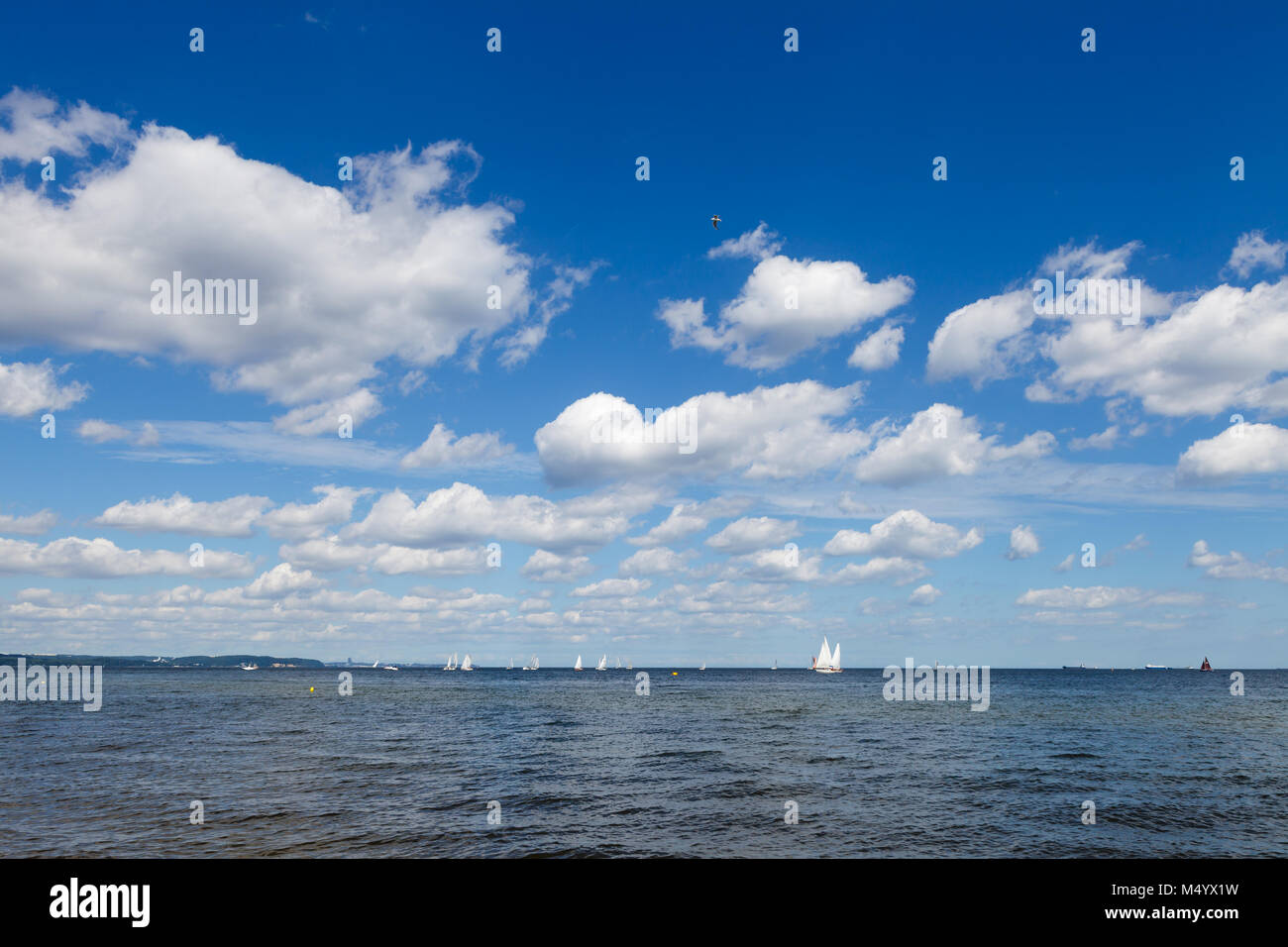 Blue sky with white clouds over sea Stock Photo - Alamy