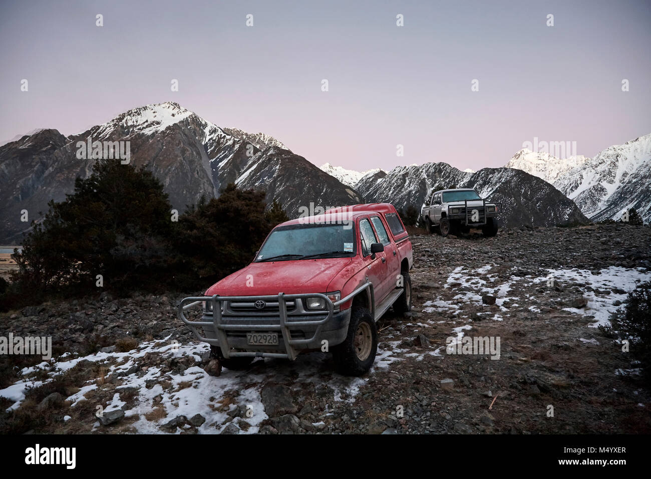 Suvs parked in wild on hunting trip, South Island, New Zealand Stock Photo