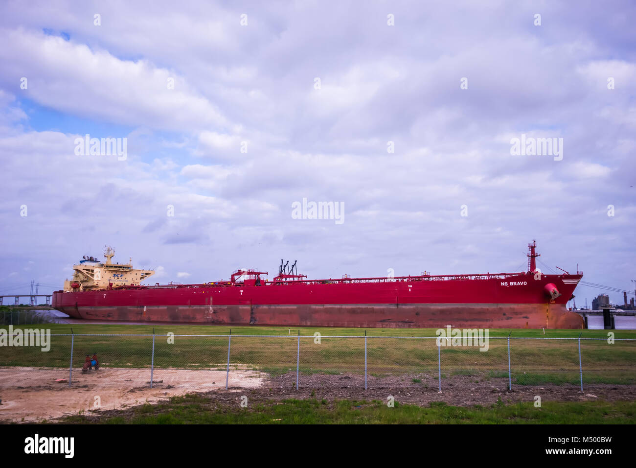 large red cargo ship parked on gulf of mexico coast Stock Photo