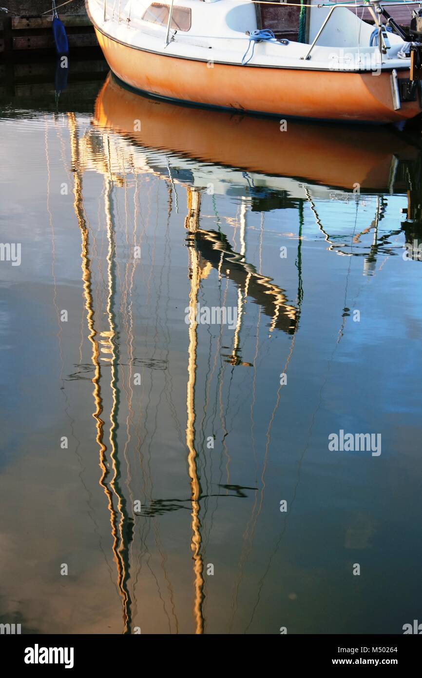 Boat reflected in water Stock Photo - Alamy
