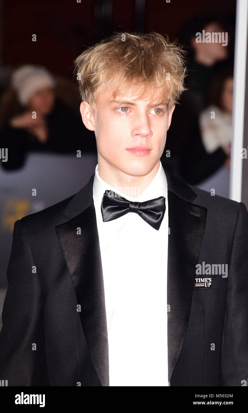 Tom Taylor attending The EE British Academy Film Awards, at The Royal Albert Hall London Sunday 18th February. Stock Photo