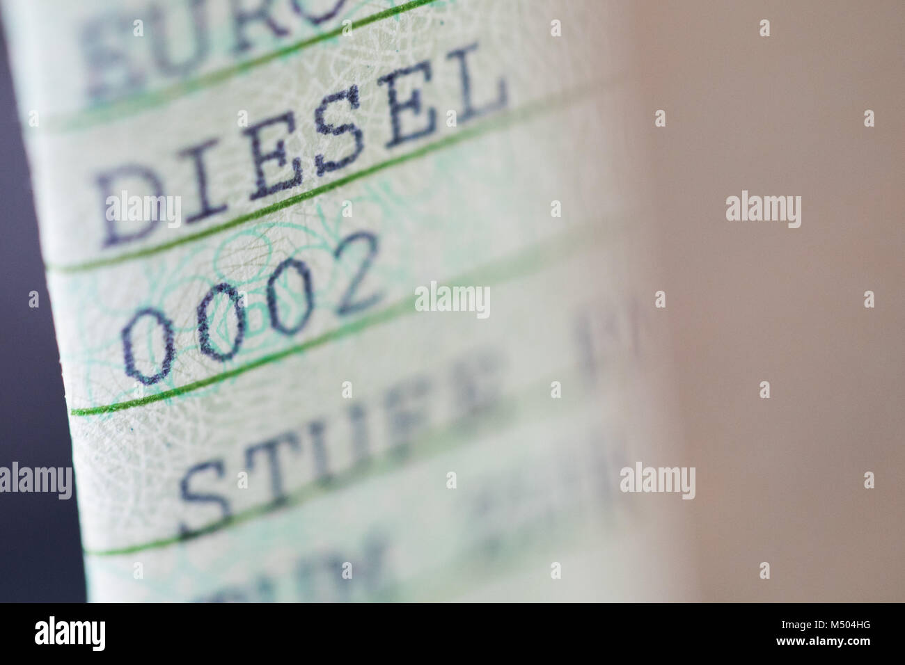 ILLUSTRATION - 19 February 2018, Cologne, Germany: The word 'DIESEL' is printed on a vehicle registration document. The air within German urban areas has worsened. The nitrogen oxide levels have been increasing, and with them Diesel vehicles have come under attack. The federal administrative court will decide on a sentence for a suitable solution this week. Photo: Rolf Vennenbernd/dpa Stock Photo