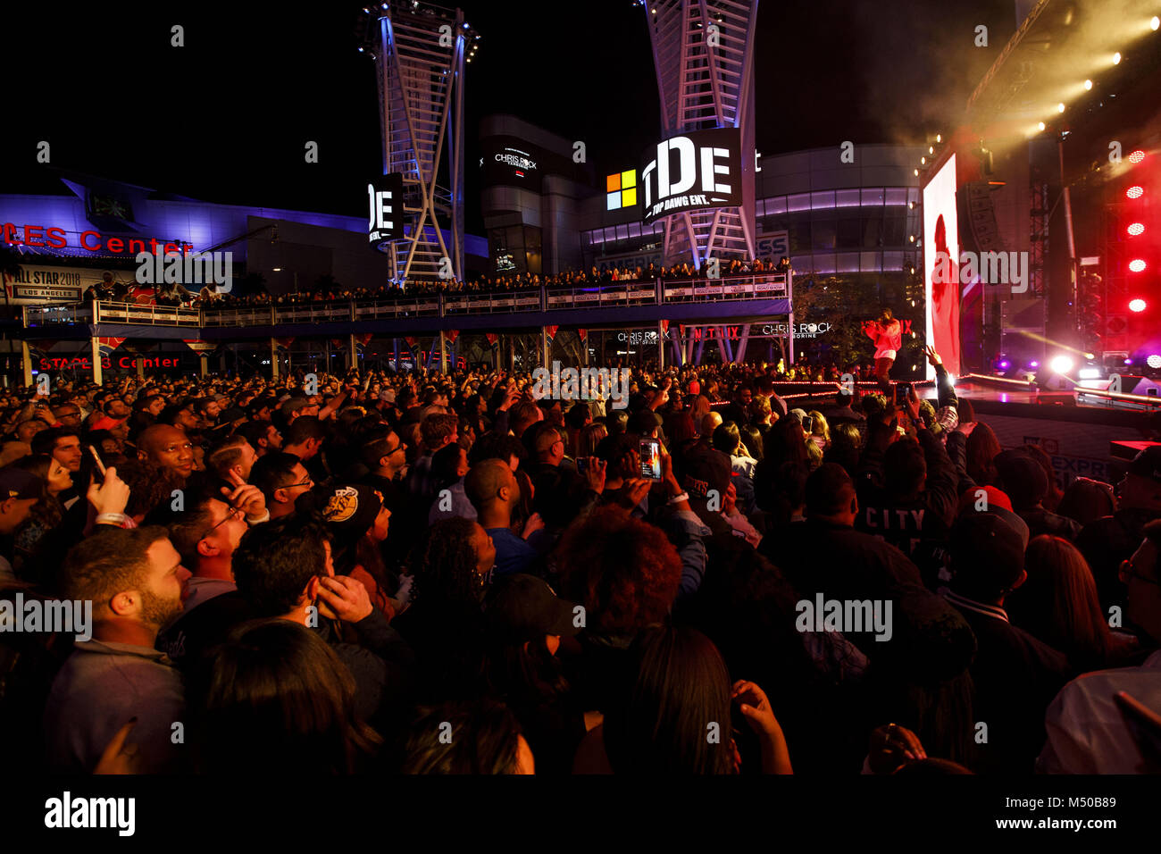 Los Angeles, CA, USA. 16th Feb, 2018. Fans react as artist Kendrick Lamar  performs at L.A. Live during the NBA All-Stars weekend road show concert on  Friday, February 16, 2018 in downtown