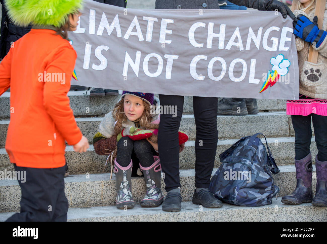 Ashlyn Molloy 5 Sits While Her Mother Holds A Sign During A Rally On The Steps Of The Capitol Building In Olympia On Monday Ashlyn Molloy 5 Sits While Her Mother Holds A Sign During A Rally On The Steps Of The Capitol Building In Olympia On Monday