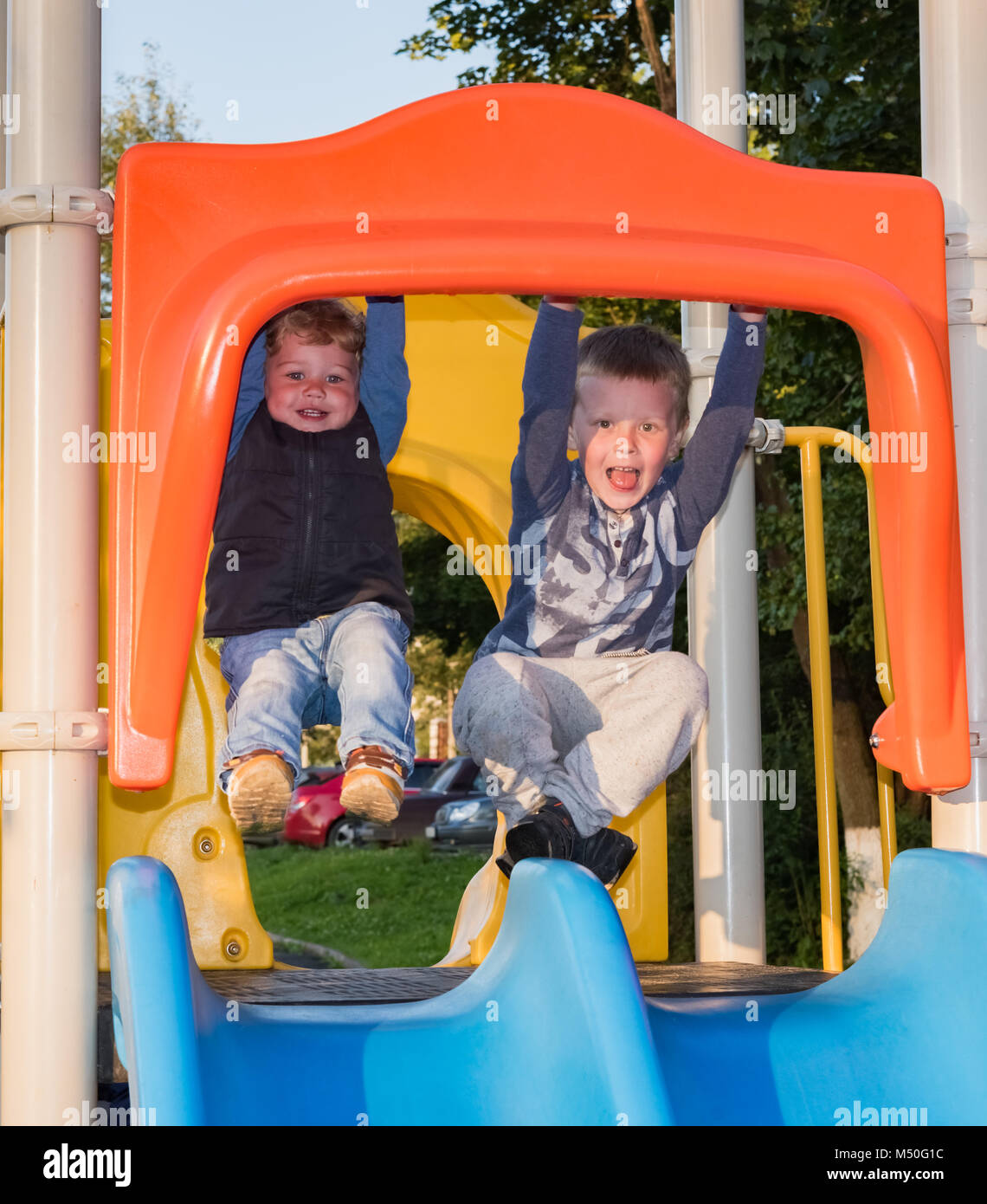Two brothers on the playground Stock Photo Alamy