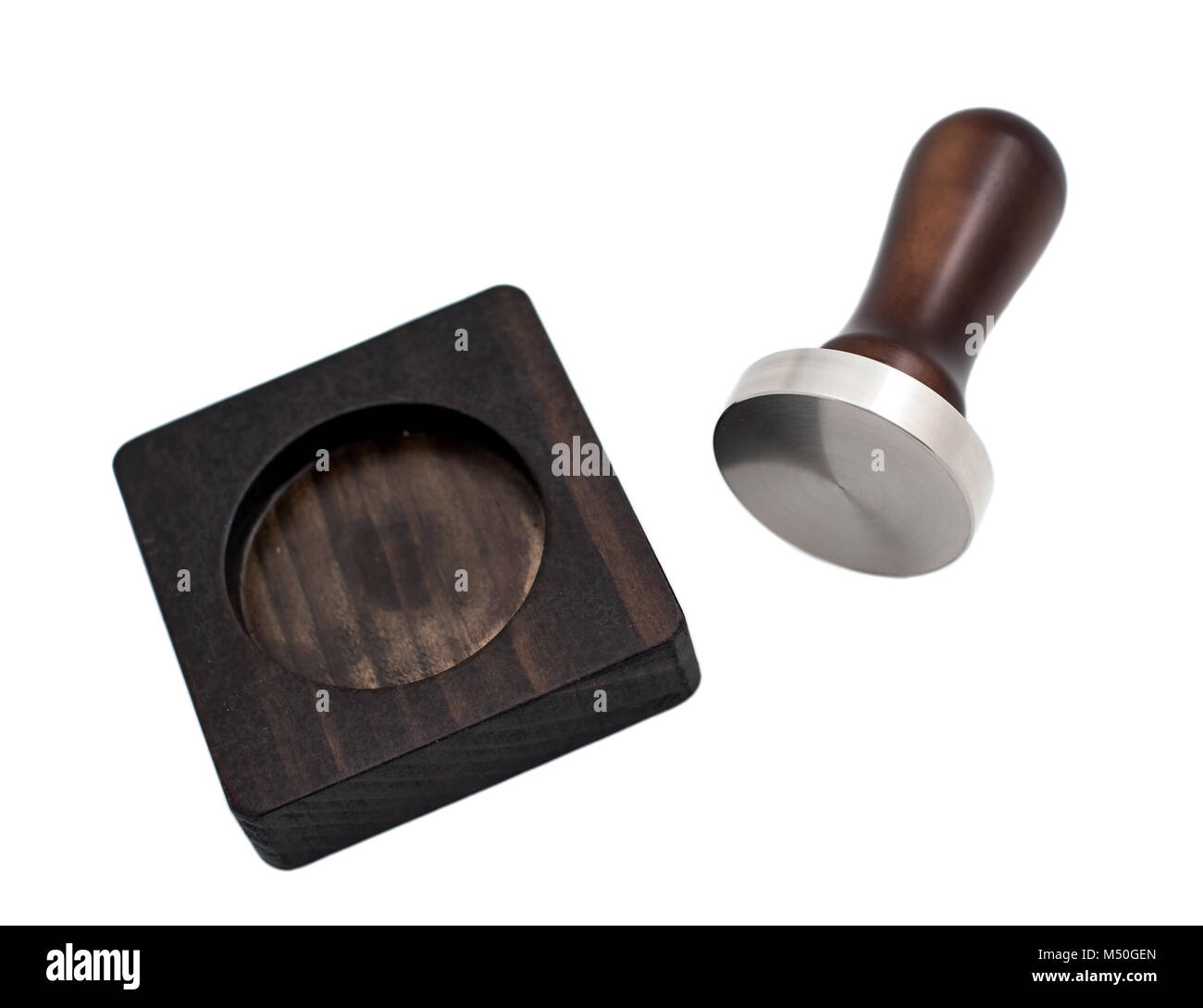 wood and brass barista tamper a white background Stock Photo