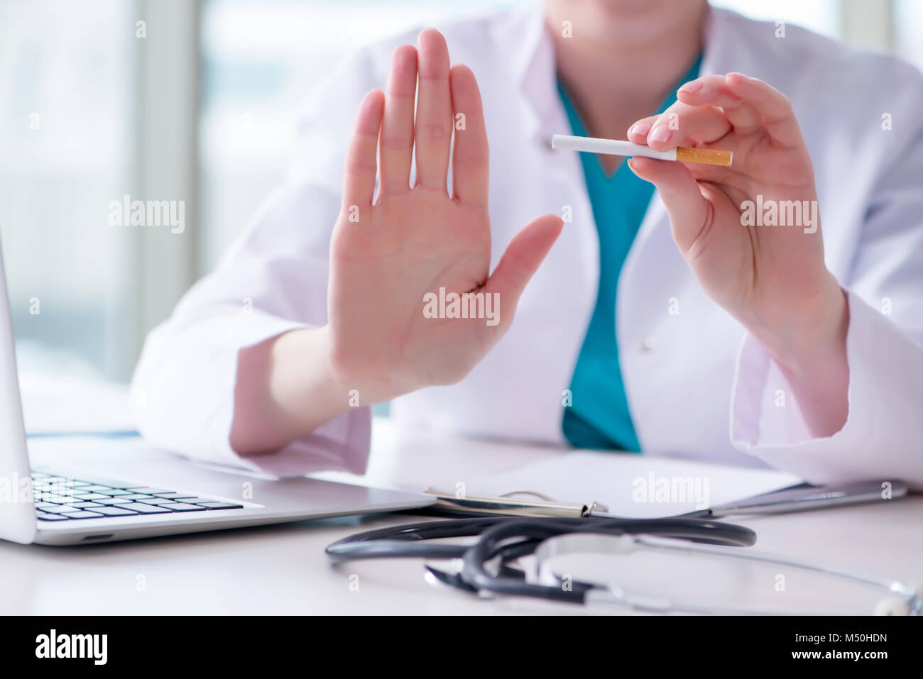 Doctor in anti smoking concept Stock Photo - Alamy
