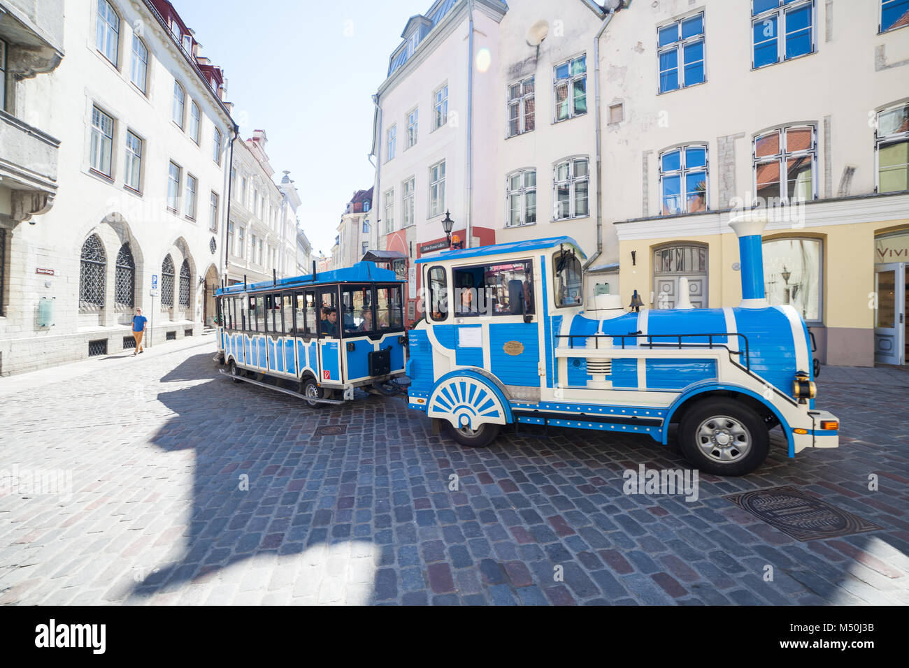 Tourist train car on the street of old Tallinn Stock Photo