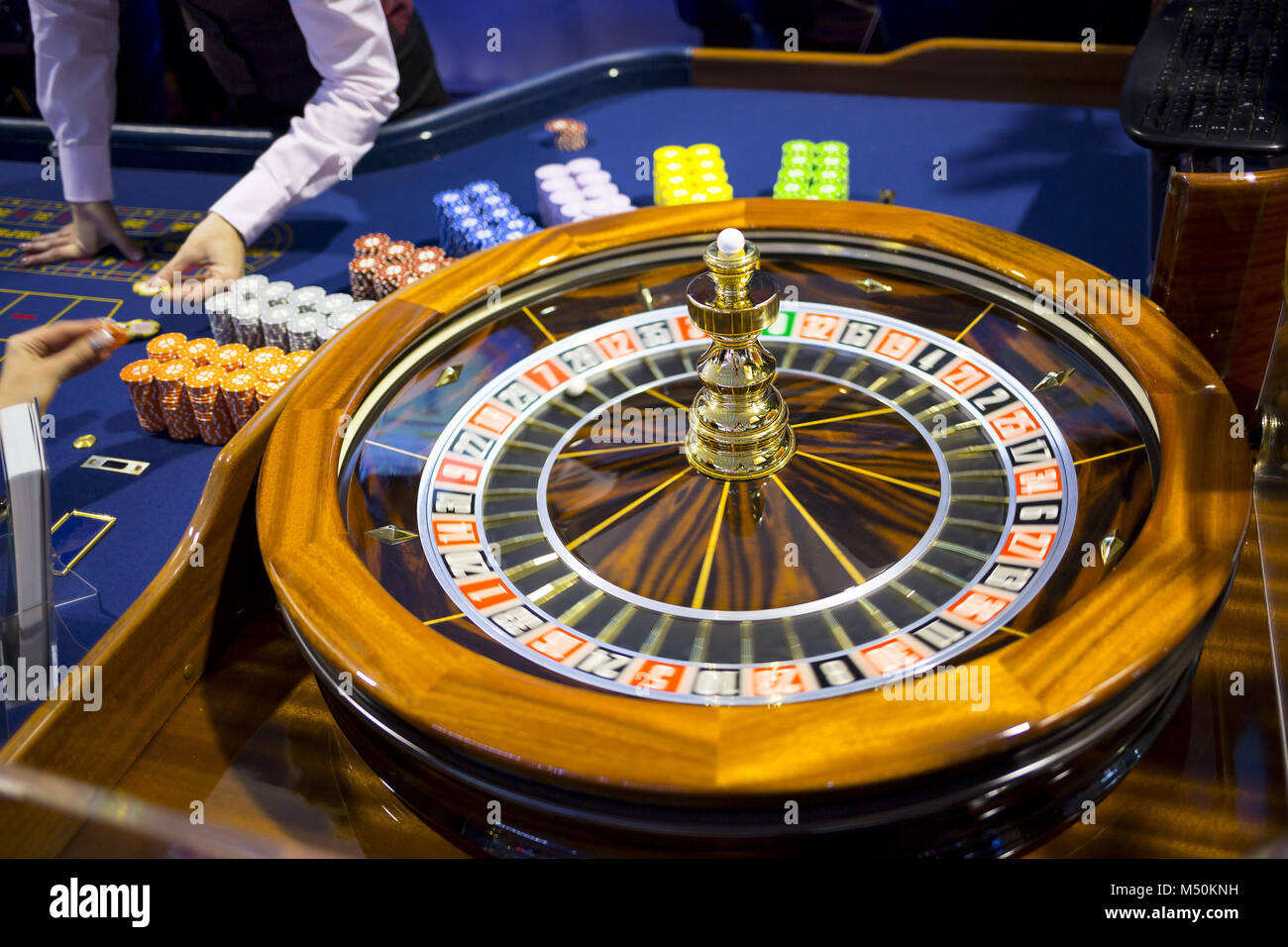 Wooden Roulette table in casino chips Stock Photo Alamy