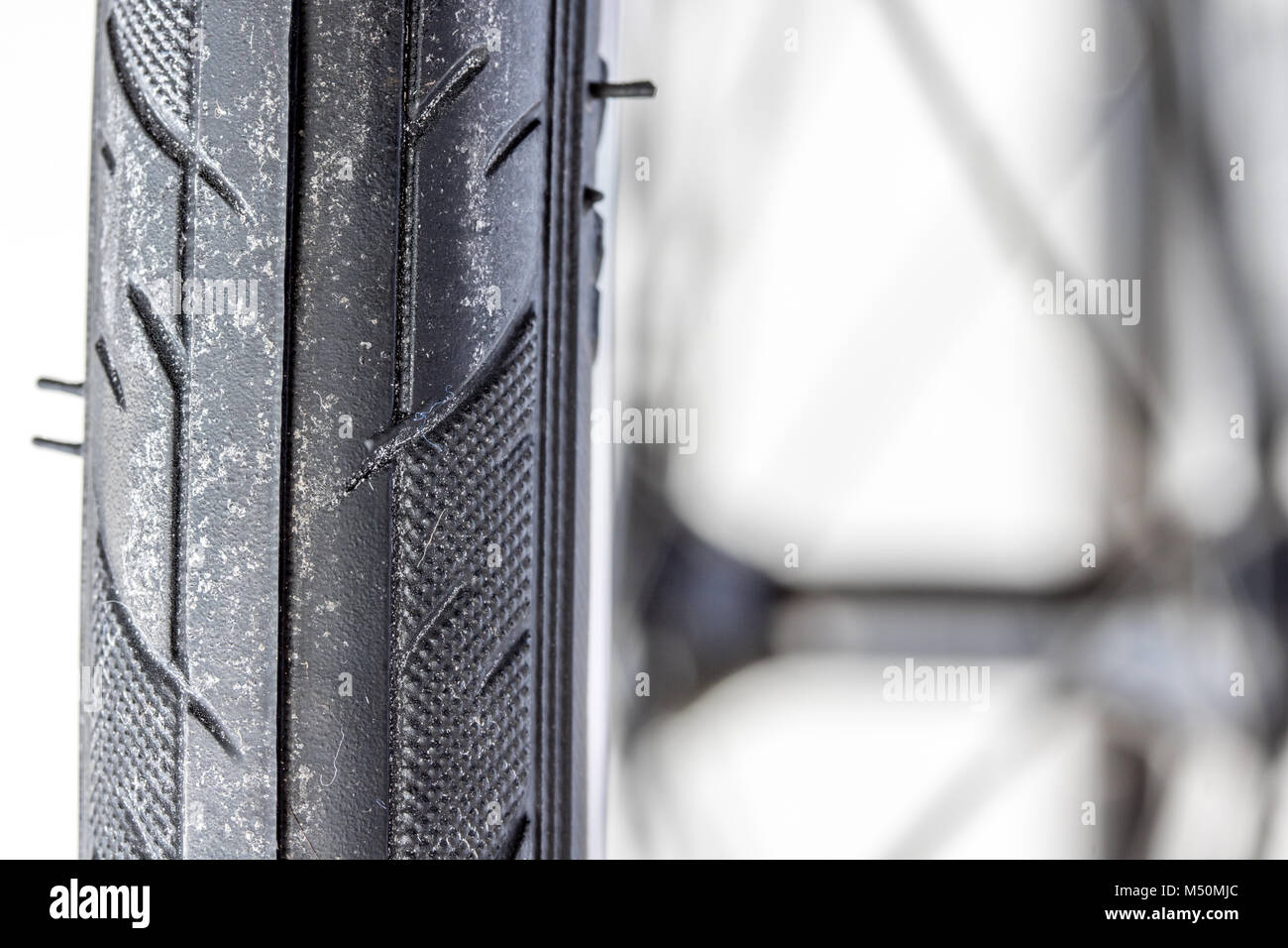 Close-up view and tread pattern of the bicycle. Detail of tire from road bike. Stock Photo