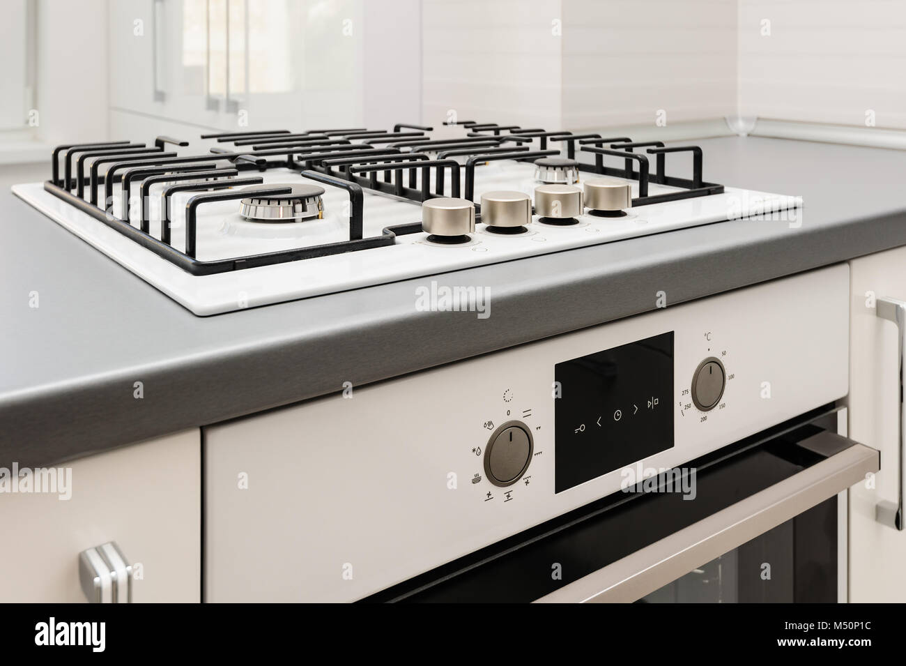 Brand new gas stove and embedded oven Stock Photo