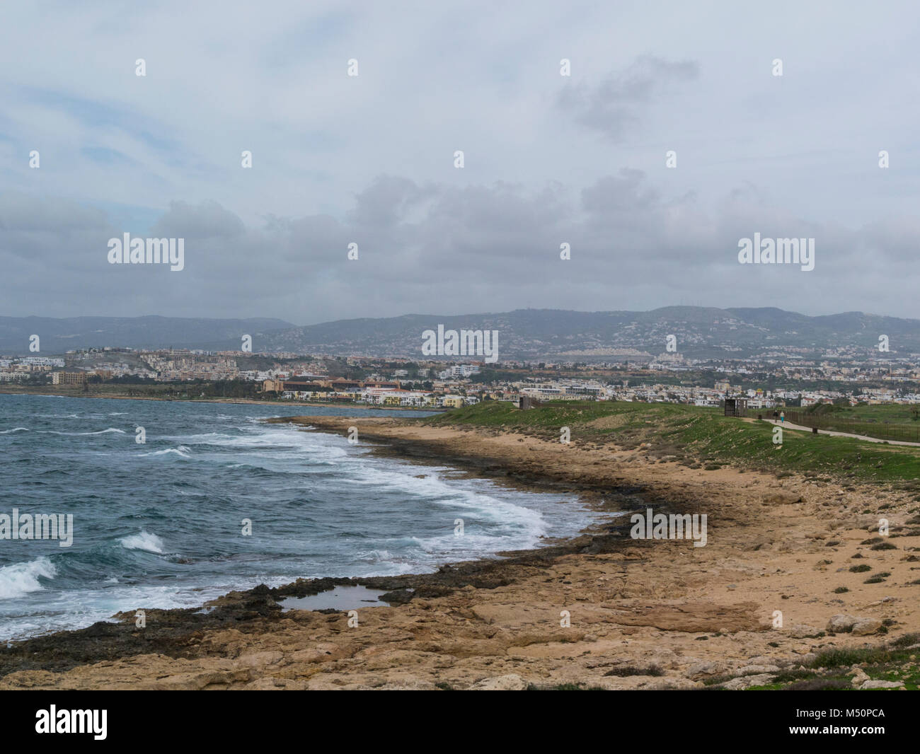View along Paphos coastal path towards Kefalos Beach and Pano Pafos Old Market Area in Upper town Cyprus Stock Photo